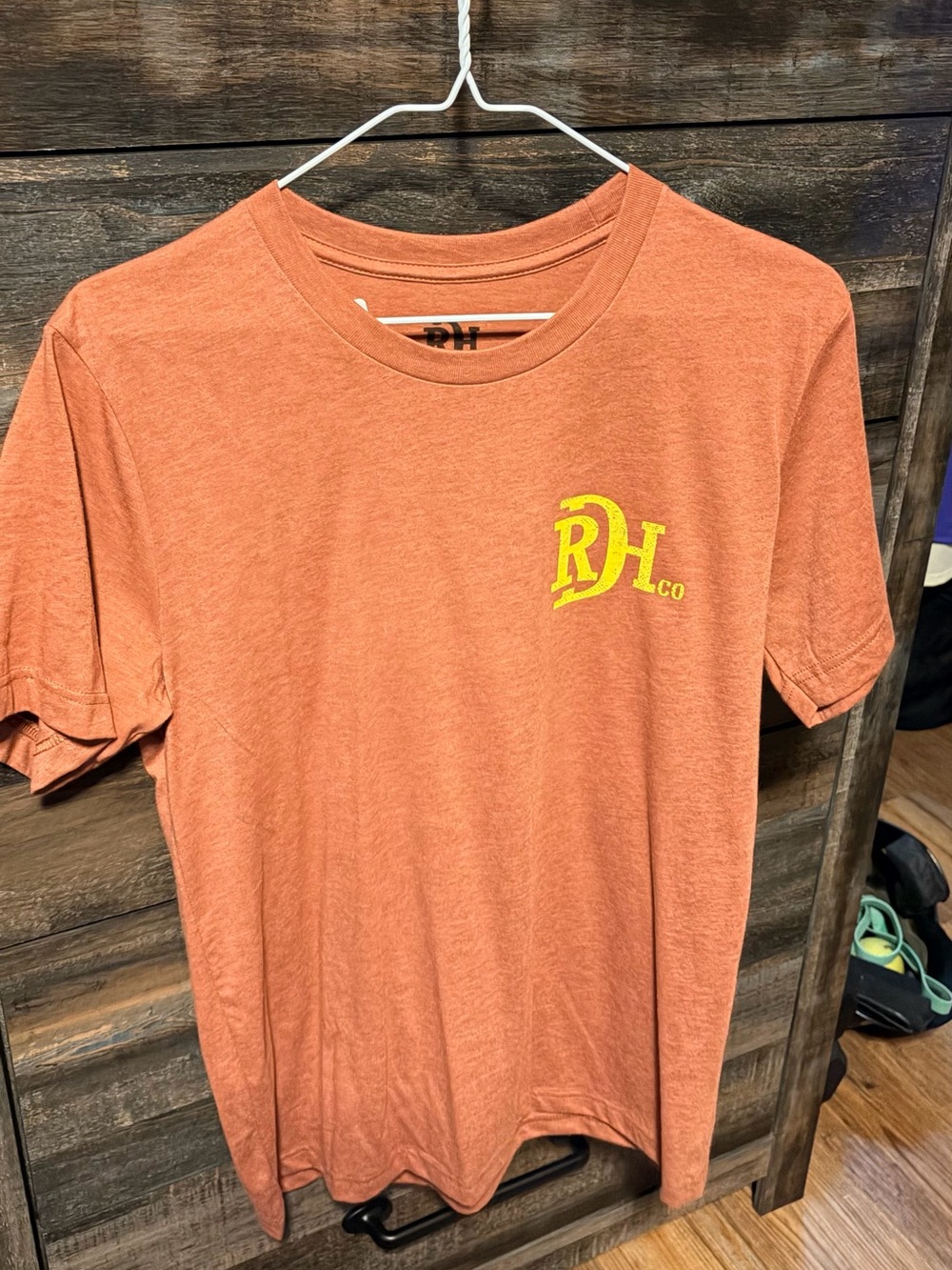 Red Dirt Hat Co. Men's Short Sleeve Crew Tee in Rust with Yellow Logo
